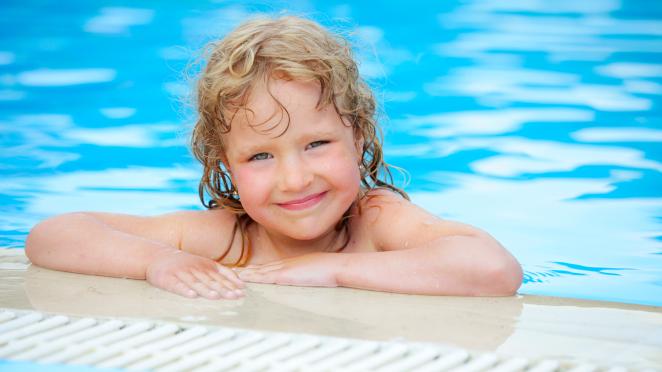 Little girl at pool edge