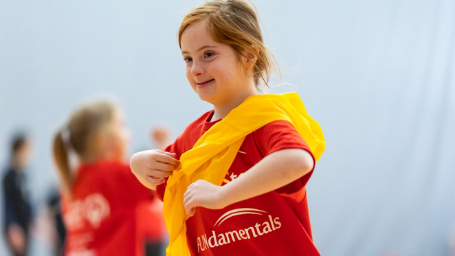 young girl playing in the gym